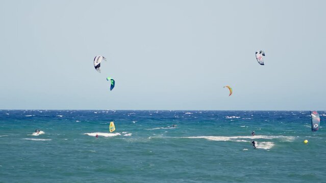 Group of people wind surfing in the ocean