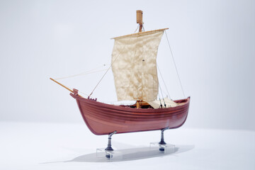 The small model of historical ancient ship in marine museum.