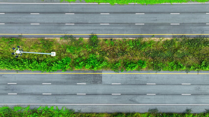 Drone aerial view : Tranquility as you gaze upon a deserted intercity motorway, where the absence...