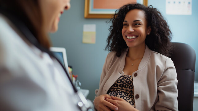 In the warm glow of the examination room, the pregnant woman engages in conversation with her doctor, her smile radiant as she discusses her pregnancy milestones and upcoming prena