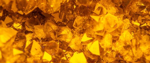Golden crystal mineral stone. Gems. Mineral crystals in the natural environment. Texture of...