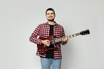 PNG,Attractive young guy playing the guitar, isolated on white background