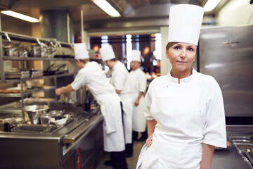 Restaurant, chef and portrait of woman in kitchen for hospitality service, cuisine and career. Fine...