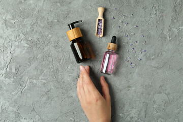 Lavender oil in a bottle on a light background