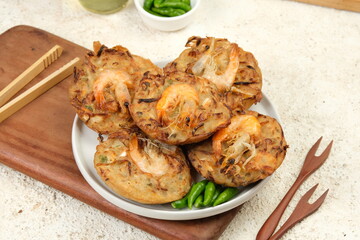 Bakwan Pontianak (bakwan udang) or vegetable fritters is an Indonesian traditional snack made from...