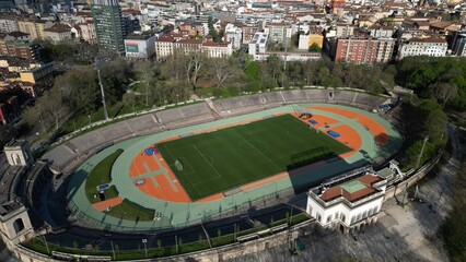 Aerial View of a Historic Stadium With Track and Field Amidst Urban Landscape at Dusk. Milan, Italy