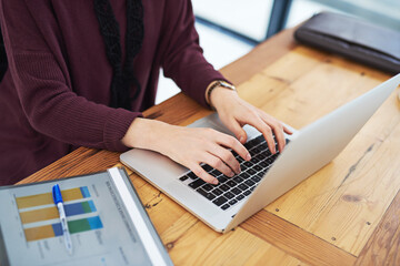 Business, person and hands with laptop in office to analyse income chart or strategy graph tor review financial report. Corporate, people and paper for research with statistics for company growth