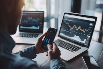 business, technology, internet and people concept - close up of man with laptop computer and smartphone with stock market chart on screen over office background