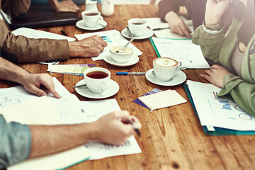 Business people, hands and paperwork with graphs at meeting report for company, productivity or...