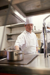 Cooking, chef thinking and Asian man in kitchen at restaurant for fine dining, service or hospitality. Idea, culinary professional or worker prepare meal, lunch or dinner for food catering in hotel