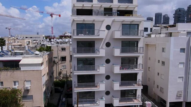 Drone shot of the white buildings that stand out in the city of Tel Aviv, Israel.