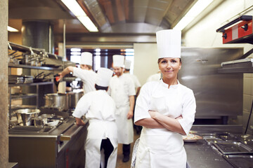 Chef, arms crossed and portrait of woman in kitchen for hospitality service, cuisine and career....