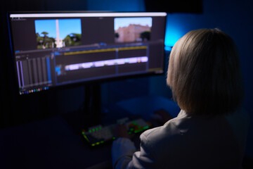 Beautiful Female Video Editor Works with Footage on Her Personal Computer, She Works in Creative...