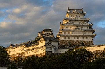 Late afternoon sunlight shines on HImeji Castle in Hyogo Prefecture, Japan.