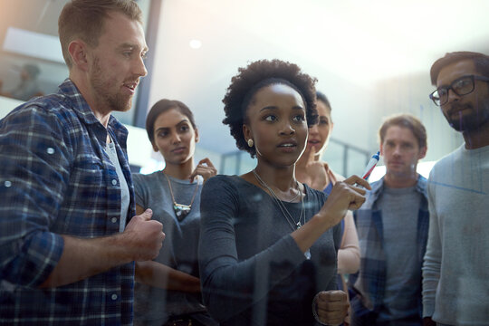 Glass, planning and business people thinking in office for solution, collaboration and goal objectives. Training, coaching and manager with storyboard notes for growth, target or our vision agenda