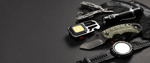 Everyday carry EDC items for men in black color - flashlight, watch and knife. Survival set....