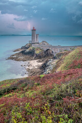 View of the lighthouse du Petit Minou in Plouzane, on a stormy day, Brittany, France.