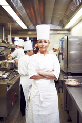 Arms crossed, woman and portrait of chef in restaurant for hospitality service, cuisine and pride....