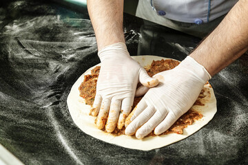 Person Wearing White Gloves Holding Gloves on a Plate