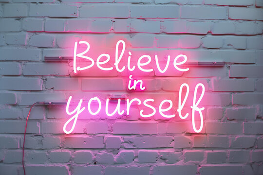 Neon sign with the words believe in yourself on white brick wall, pink neon light, urban art style. motivational phrase, motivation, affirmation