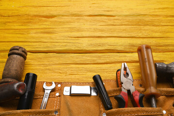 Construction concept background. Building work tool on the wooden workbench background. Top view....
