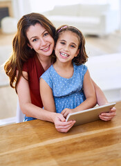 Mother, girl and tablet in portrait in home, online class and remote learning or education at table. Daughter, mama and streaming cartoon or games for development, bonding and support in childhood