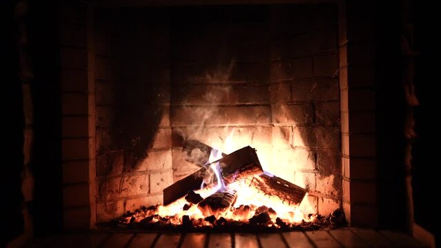 Fireplace. Cozy Relaxing Fireplace. Firewood. Flames of a country house. Warmth and home comfort. Hearth. fire is burning in the fireplace. beautiful fire in the fireplace, Wood burning 