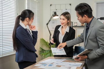 Asian businessmen, women and men Talk about new projects, presents at home office.