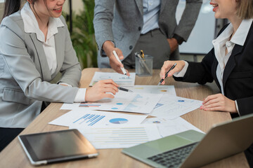 Asian businessmen, women and men Talk about new projects, presents at home office.
