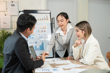 Asian businessmen, women and men Talk about new projects, presents at home office.