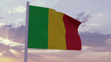 Flag of Mali in the wind on a sunset sky