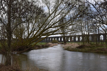 Fototapeta na wymiar the arches of the harringworth viaduct (or welland viaduct) one of the longest railway viaducts across a valley in the uk
