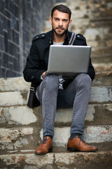 Man, thinking and laptop on stairs for remote work, email, and research for writing. Creative, male...