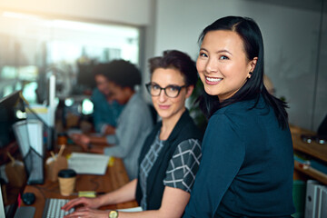 Women, web designer and smile in portrait as employees in workplace for development, collaboration...