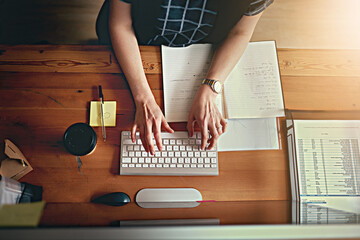 Woman, hands and keyboard at desk for schedule, planning and research for project in office. Graphic designer, typing and computer with documents in creative agency for email, notebook and networking - Powered by Adobe