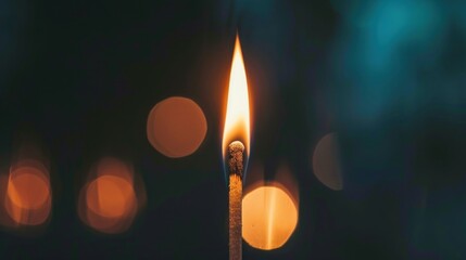 flame of wooden match on black background bokeh