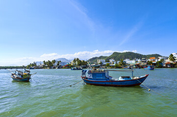 Fototapeta na wymiar Lonely Fishing Boat at Nha Trang Harbor, Vietnam