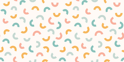 Abstract arch shapes pastel seamless pattern. Scattered small shapes rainbow squiggle pastel gender neutral background.