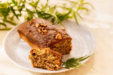 Freshly tasty baked bread with the addition of cannabis, decorated with hemp leaves