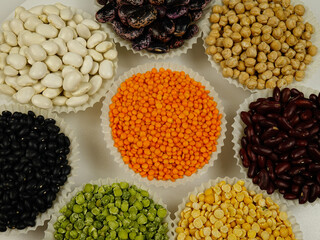 Various sorts of legumes that are used as a dry grain for human consumption, colorful natural texture background. - obrazy, fototapety, plakaty