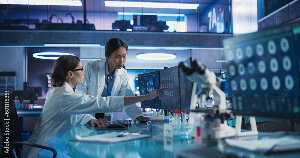 Aufkleber medical research center laboratory: caucasian and asian female scientists talking and using desktop 