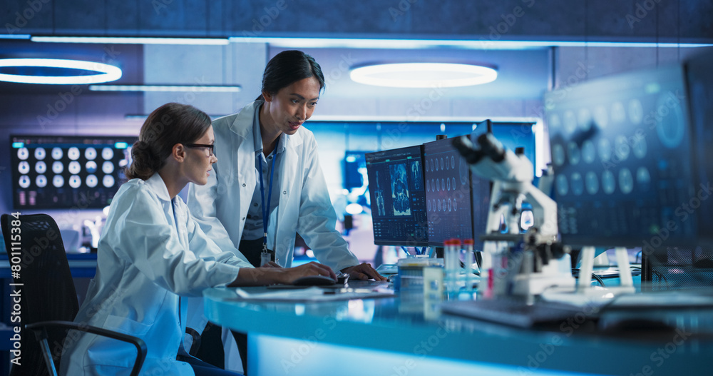Aufkleber asian and caucasian female doctors talking in medical research center and using desktop computer to 