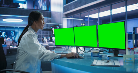 Hospital Research Laboratory: Asian Female Medical Scientist Using Computer Green Screen Chromakey...