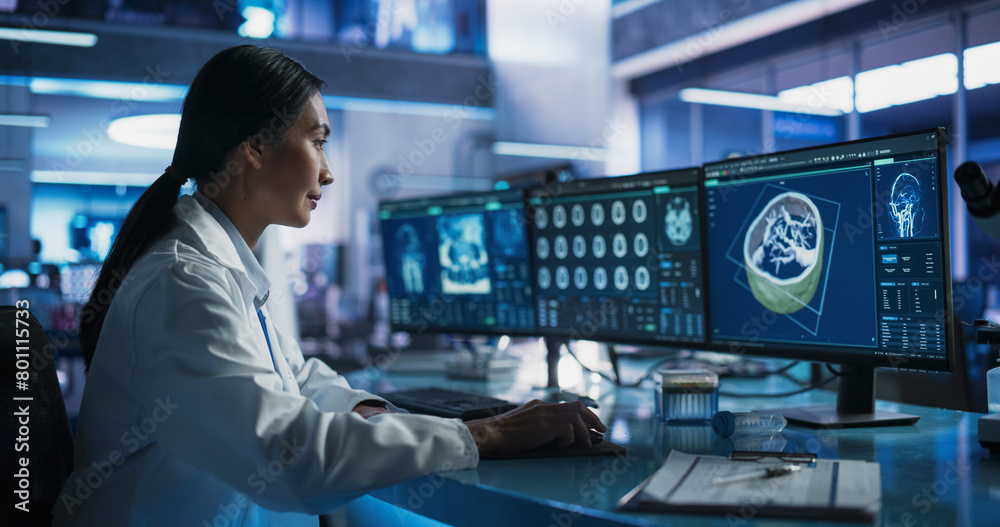 Poster female asian neuroscientist using desktop computer with human brain ct scans in modern medical resea