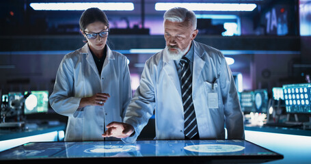 Modern Hospital Medical Cancer Research Center: Caucasian Female Neuroscientist And Male Surgeon...