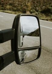 Rearview mirror view, roadtrip in Scotland