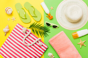 Composition with stylish beach accessories on colored background, top view. Beach fashion flat lay, summer concept. Trendy colors