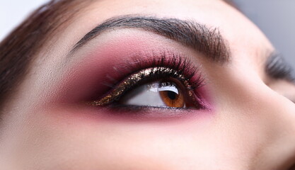 Make-up eye of young attractive woman beauty portrait. Print for showcases of cosmetic stores...