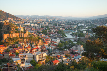 Landscape of old Tbilisi on the background of foggy mountains - obrazy, fototapety, plakaty