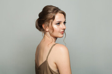 Fototapeta premium Nice fashionable model woman with natural make-up, healthy fresh skin and beautiful hairstyle, fashion studio portrait